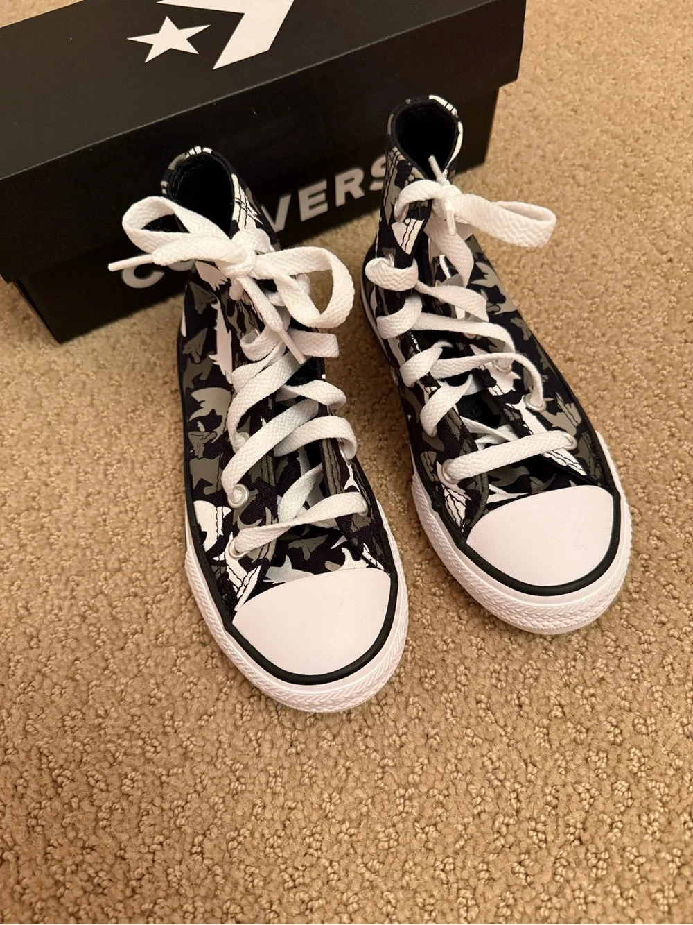 New in box. Converse high shark print sneakers. Size 11 ‘junior’.